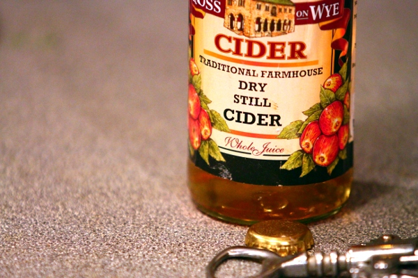 Ross on Wye Traditional Farmhouse Cider, shot of bottle with opener in the foreground. Yum.